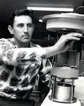 Dr. Russell Snyder, Associate Professor of Physical Oceanography works on adjusting a current meter that measures ocean current, speed and direction
